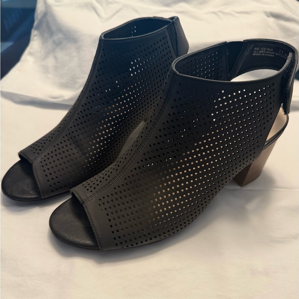 Relativity Black Heeled Boots with Peep-Toe Design